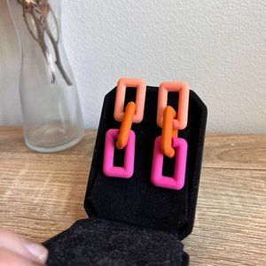 Bright pink and orange statement earrings